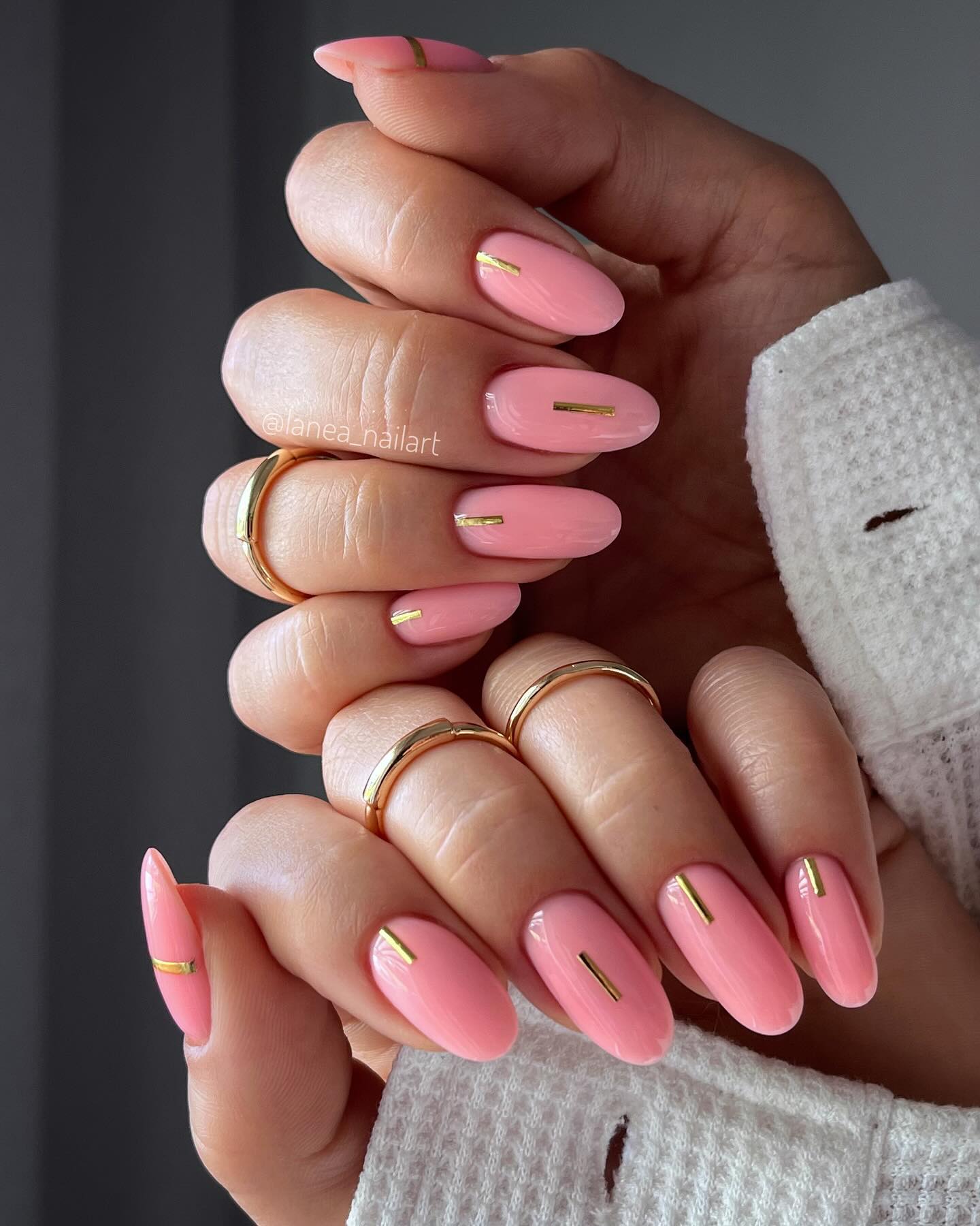 Long, sheer, glossy nude nails.