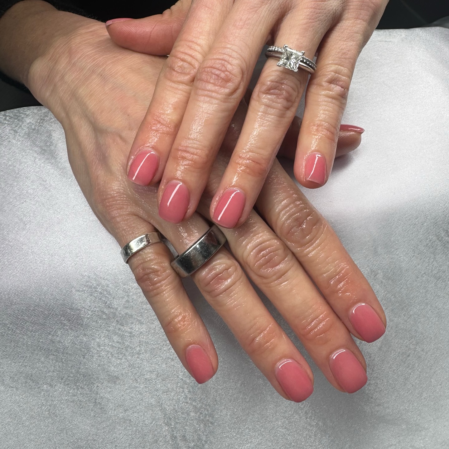 Nude nails with neon tips and tattoo-style art.