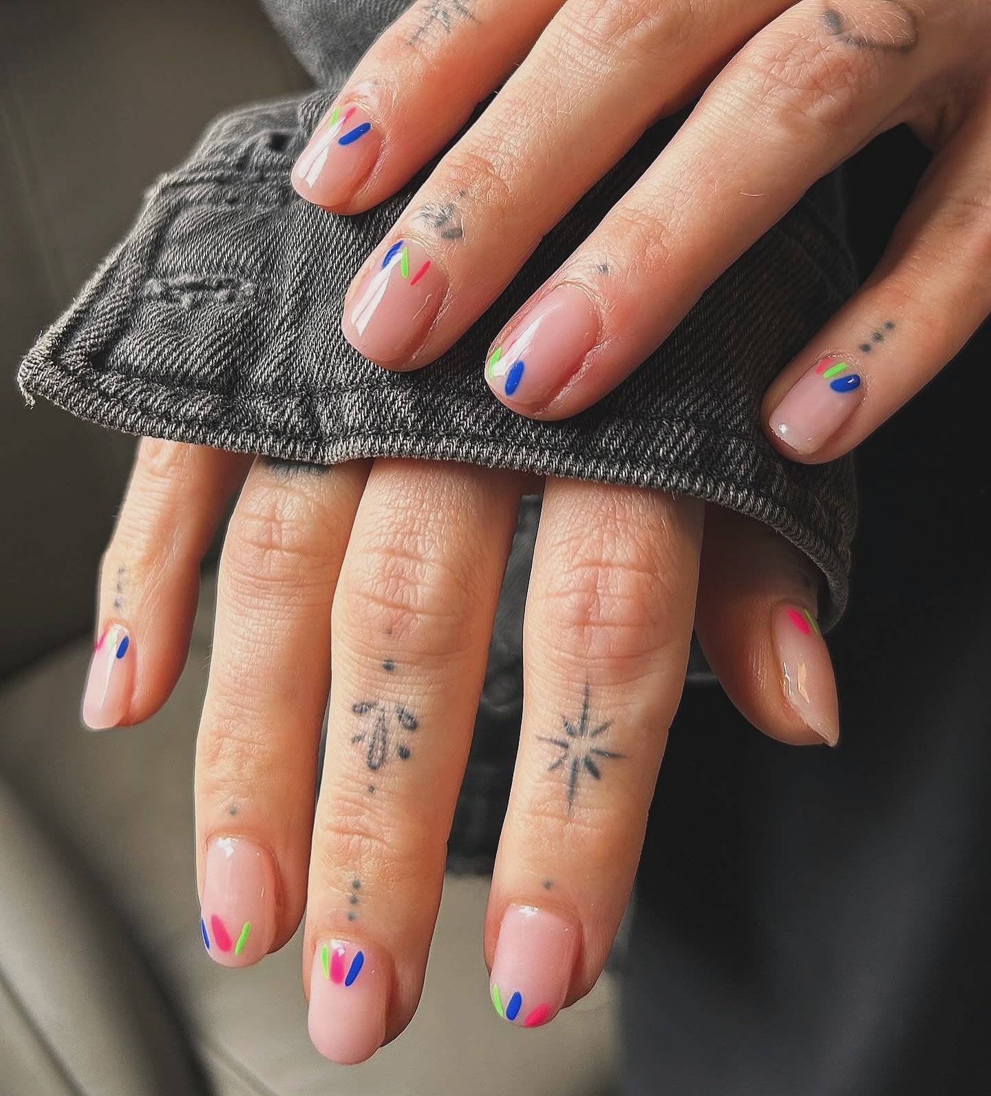 Trendy sage green short nails, minimalist style.