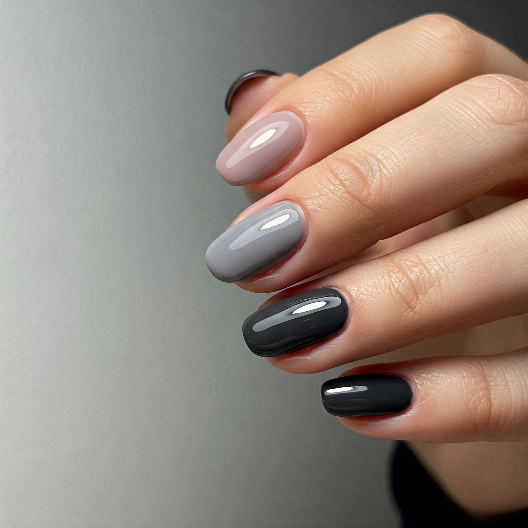 Elegant grey gradient nails, light to dark shades.